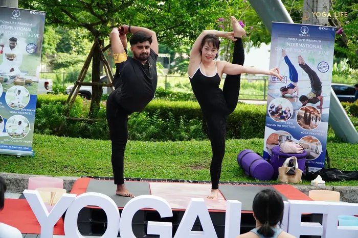 Two teachers demonstrating at the International Yoga Day event