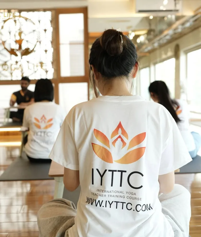 A teacher-training student in the studio between sessions